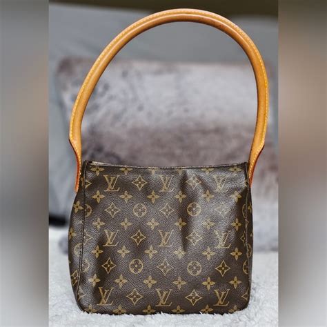 louis vuitton one handle bag.